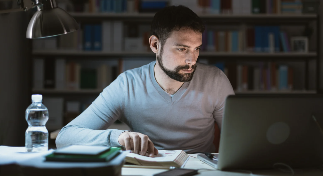 distressed man working late at night